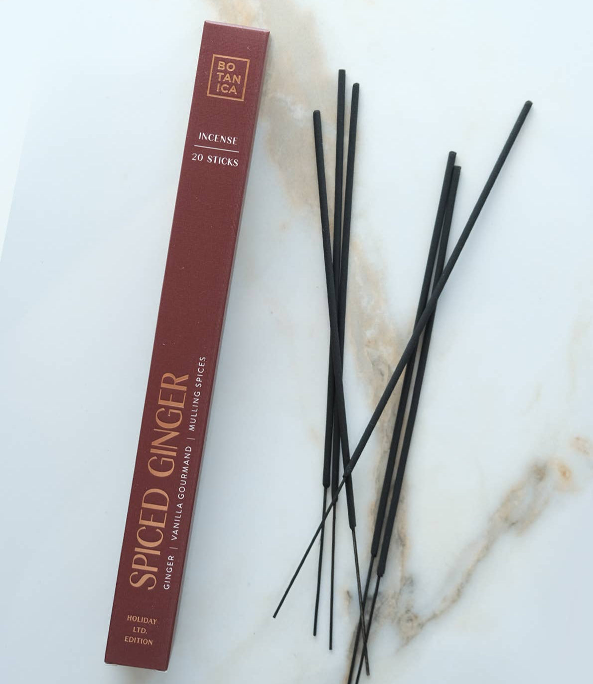 Spiced Ginger incense sticks with packaging on a marble surface