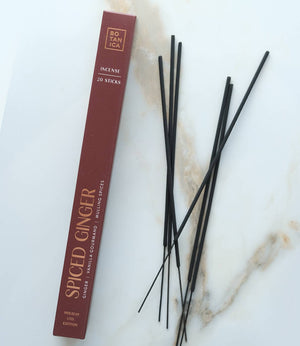 Spiced Ginger incense sticks with packaging on a marble surface