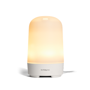 A Vitruvi Glow diffuser while lit