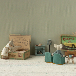Miniature diorama with two mice in a room with vintage furniture and decor.