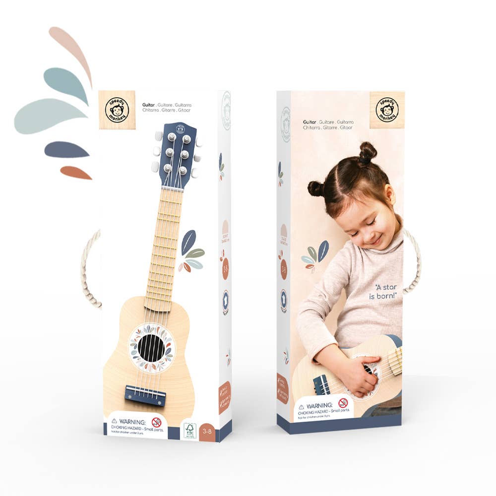 The Speedy Monkey toy guitar packaged in a decorative box