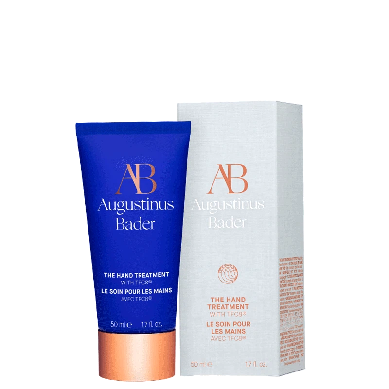 Blue tube of Augustinus Bader hand treatment on a white background