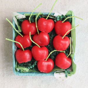 A box of organic cherry candles, made in California by Happy Organics