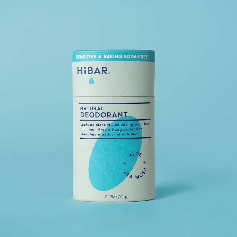 A stick of HiBAR Natural Deodorant with sensitive and baking soda-free text, alongside the brand's logo and the ingredients aloe and sea-moss.