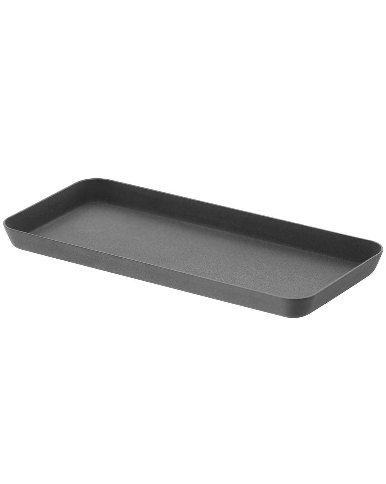 Black rectangular tray on a brown background
