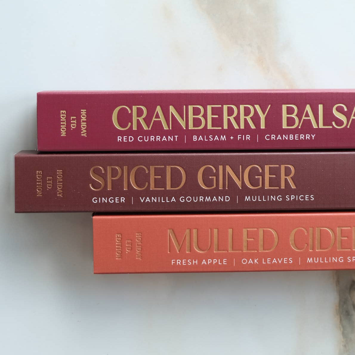 Red box of incense sticks labeled 'Mulled Cider' on a marble surface