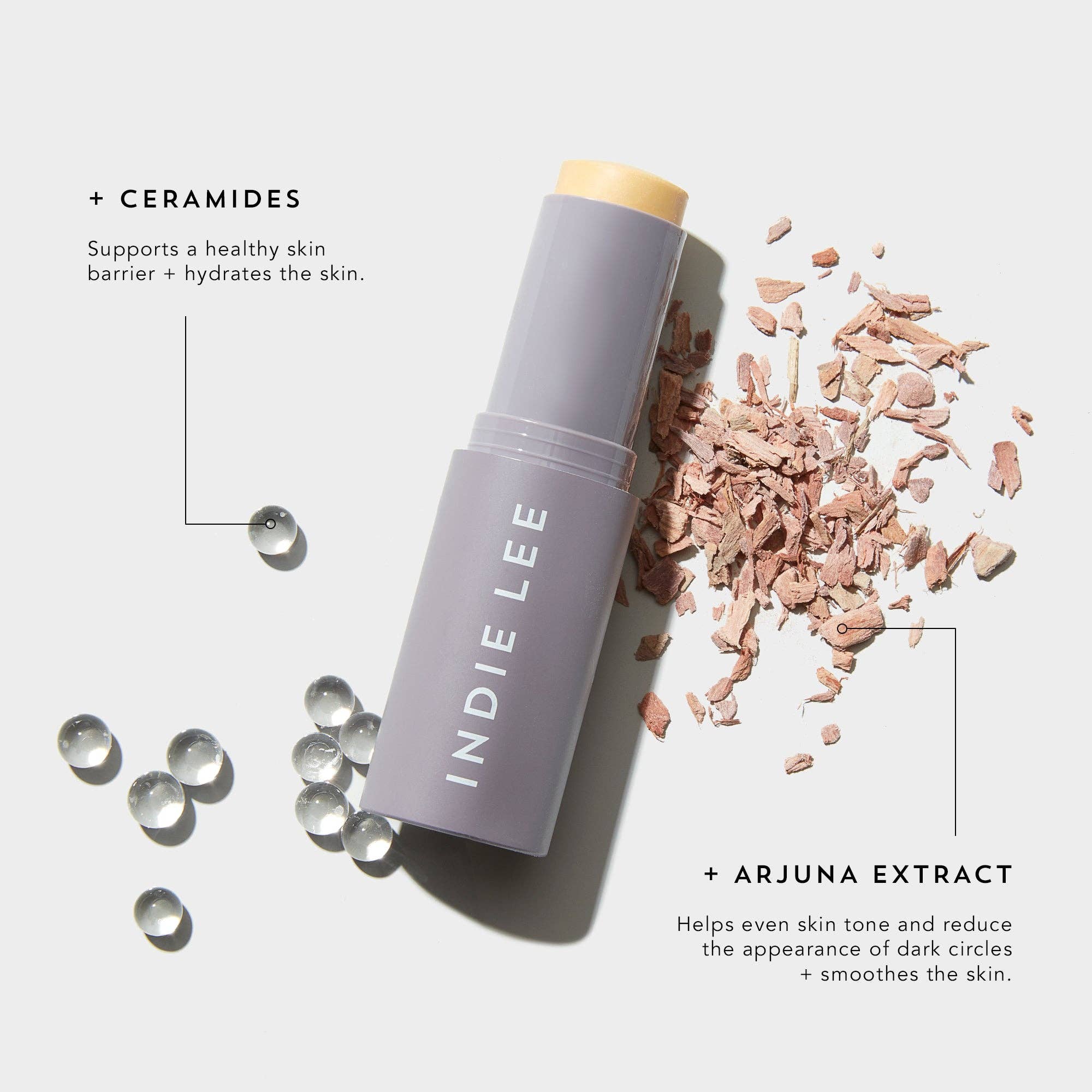 Indie Lee skincare stick with ceramides and arjuna extract on a light background