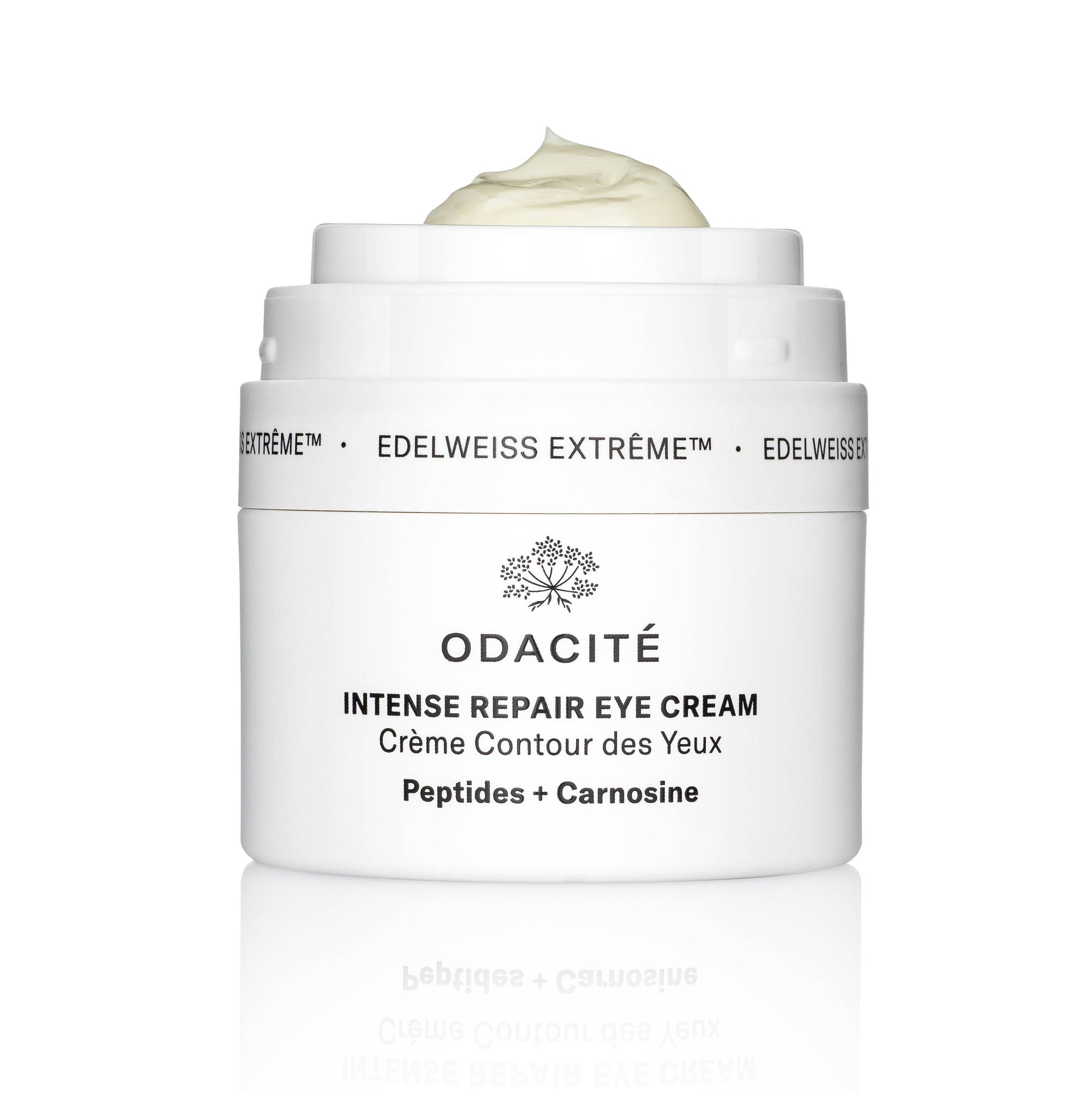 A jar of Edelweiss Extrême Intense Repair Eye Cream by Odacité with the lid open, showing the creamy texture of the product.