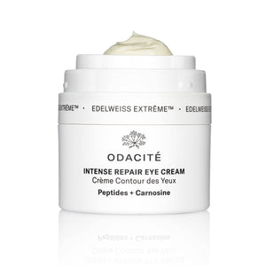A jar of Edelweiss Extrême Intense Repair Eye Cream by Odacité with the lid open, showing the creamy texture of the product.