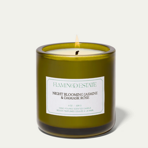 The Flamingo Estate night blooming jasmine and damask rose candle, in a green glass vessel