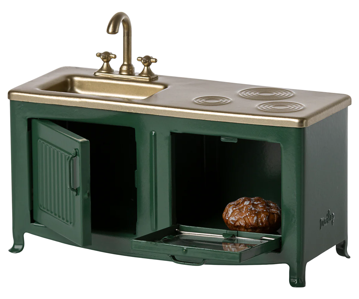 Miniature kitchen sink and stove set with green base and brass top.