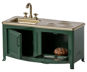 Miniature kitchen sink and stove set with green base and brass top.