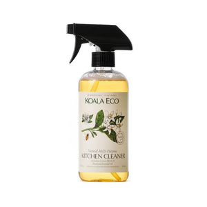 A spray bottle of Koala Eco Natural Multi-Purpose Kitchen Cleaner with a label featuring lemon myrtle and mandarin illustrations.