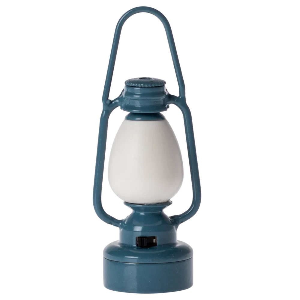 A small, blue metal lantern with a white lampshade, designed for toy mice.