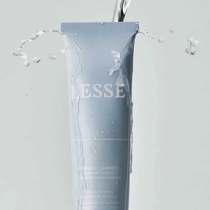 A tube of Lesse refining cleanser with water poured over the tube