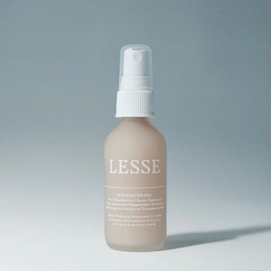 A glass bottle of Lesse regeneration mist, with a white top