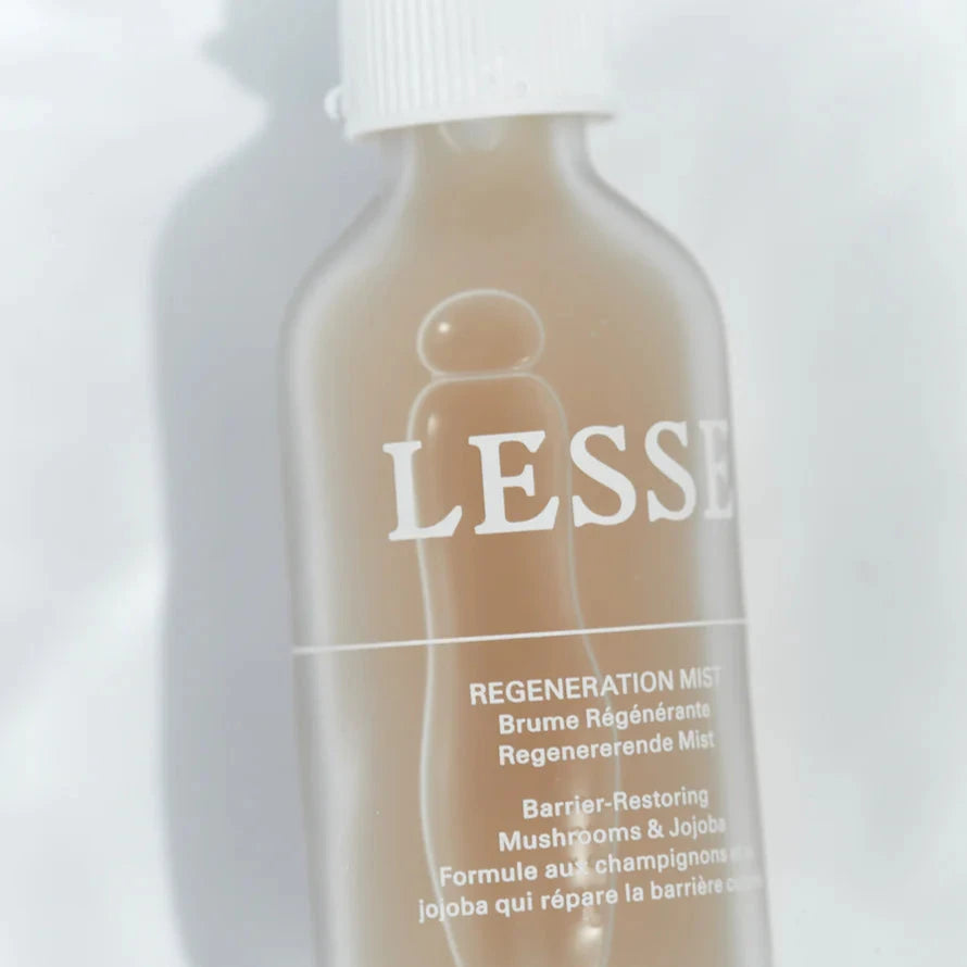 A glass bottle of Lesse regeneration mist, with a white top