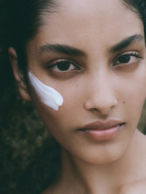 A woman with Lesse Every Tone Sunscreen SPF 30 on her face.