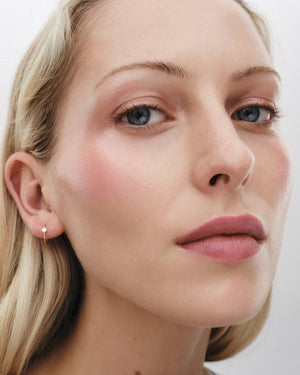 Close-up of a woman's face with a neutral background
