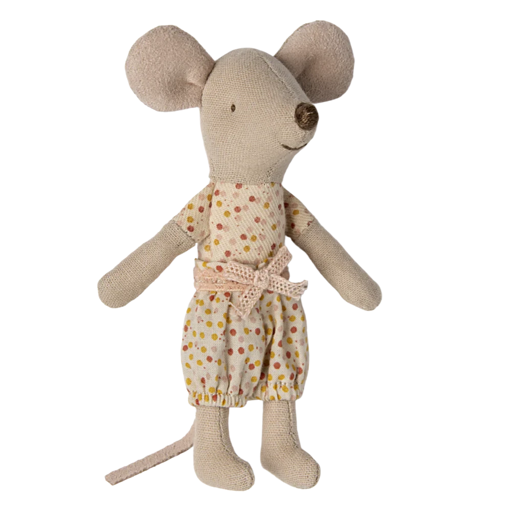 A toy mouse in a matchbox with the text 'Best Quality' on the cover, dressed in a polka dot outfit.