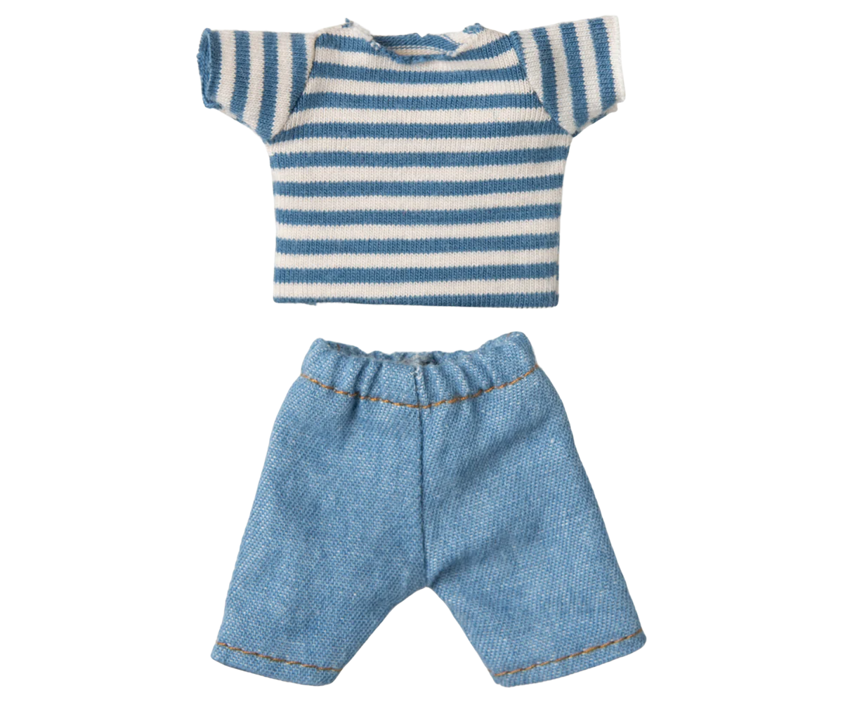 Striped shirt and denim shorts on a white background