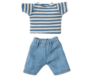 Striped shirt and denim shorts on a white background