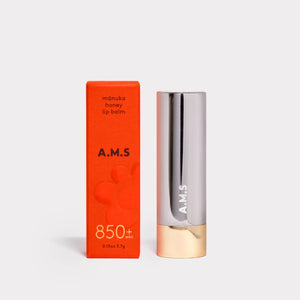 A.M.S lip balm with orange packaging on a white background