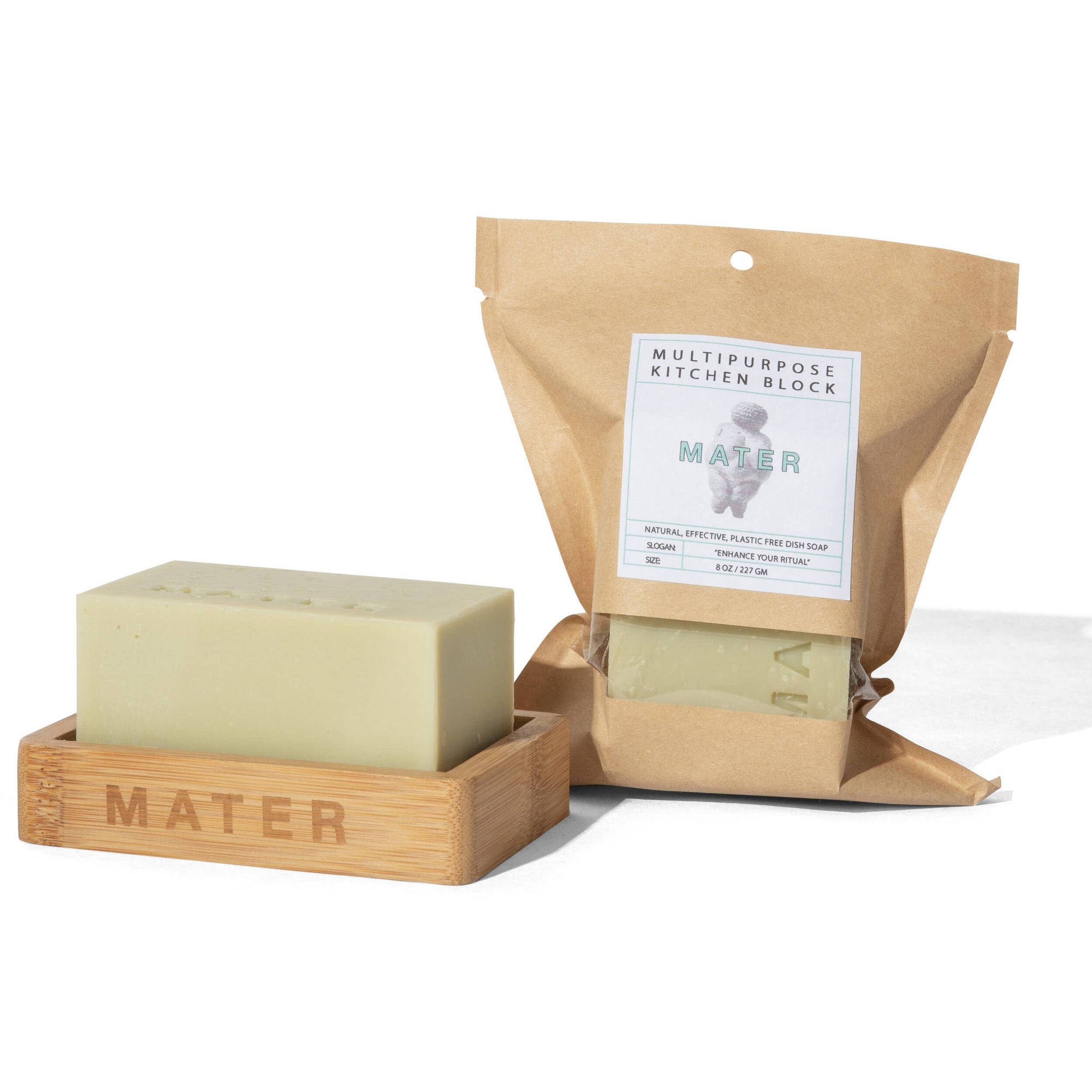 An 8 oz bar of Mater brand natural dish soap, placed on a wooden soap dish with the brand name inscribed on the side.
