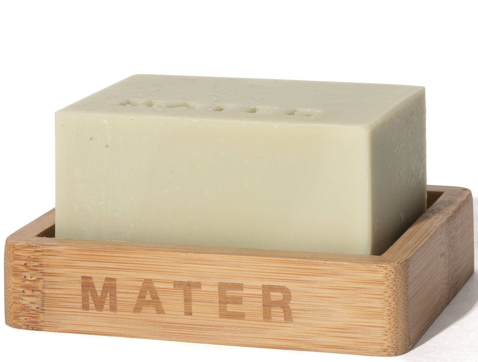An 8 oz bar of Mater brand natural dish soap, placed on a wooden soap dish with the brand name inscribed on the side.