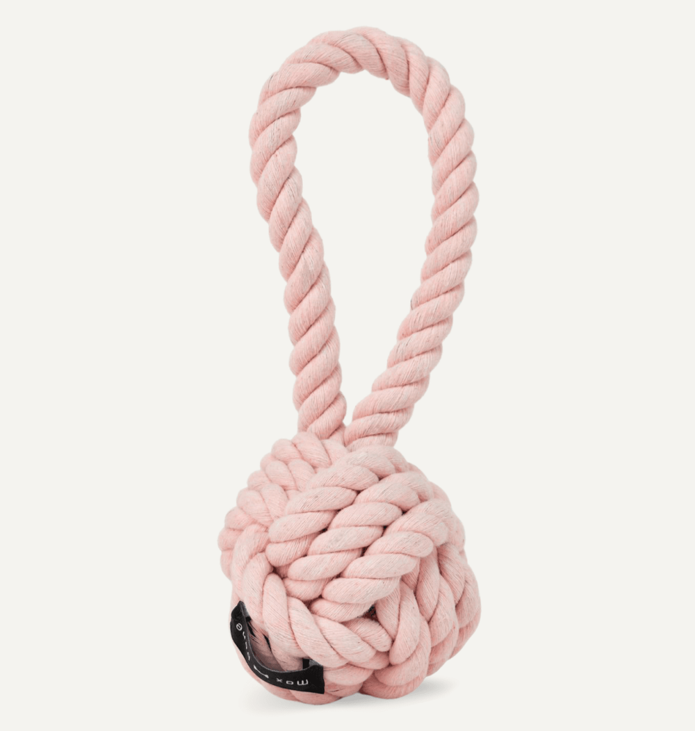 A pink knot rope dog toy, by maxbone