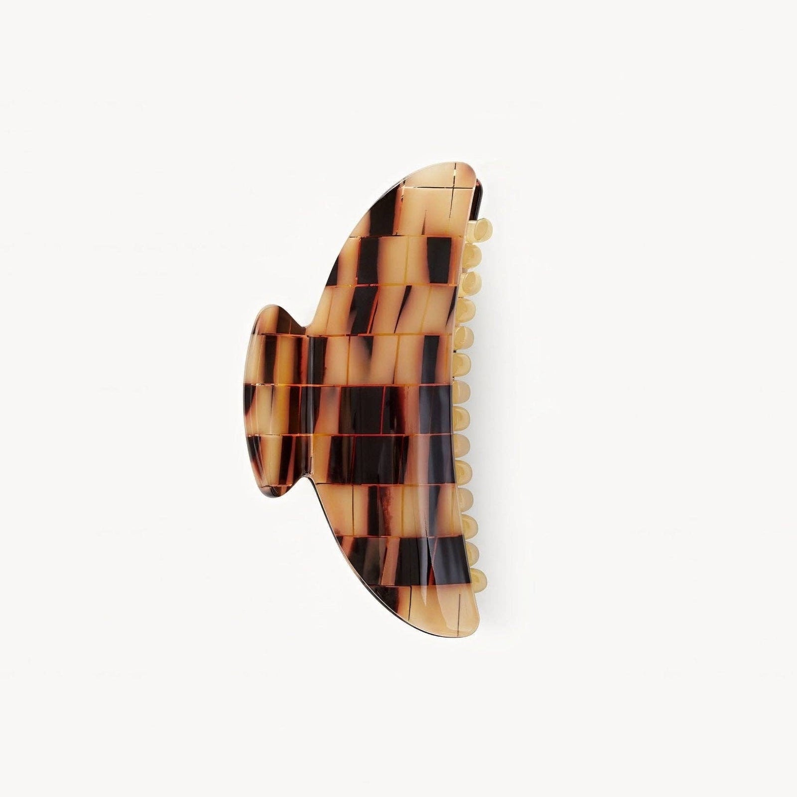 Tortoiseshell patterned hair clip on a white background