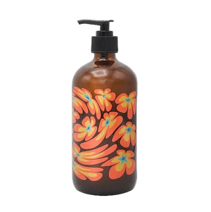 Brown bottle with colorful floral design and pump on a white background