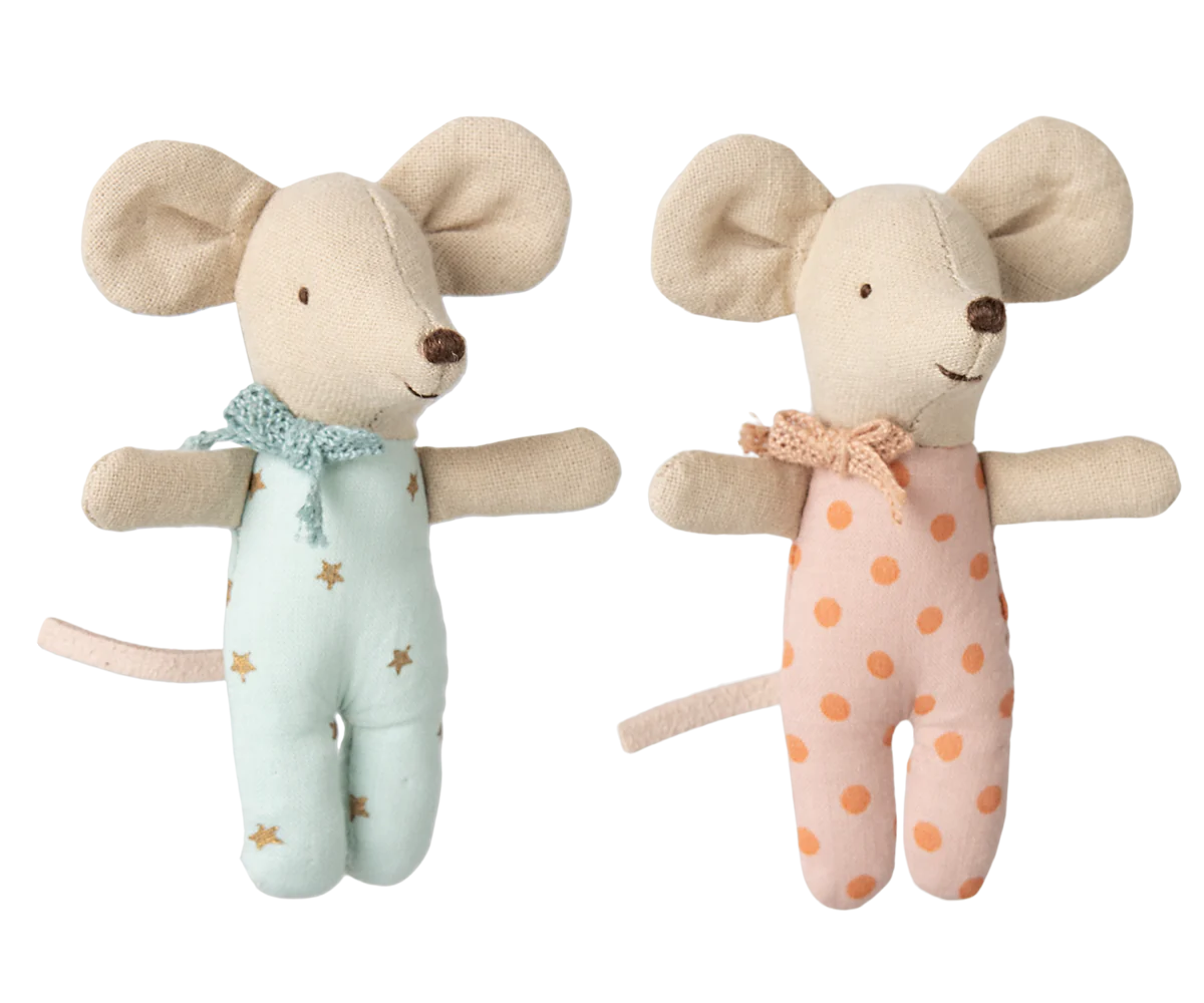 Two plush mouse toys, one in a star-patterned outfit and the other in a polka dot outfit, on a white background.