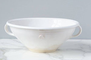 A white ceramic mixing bowl. 