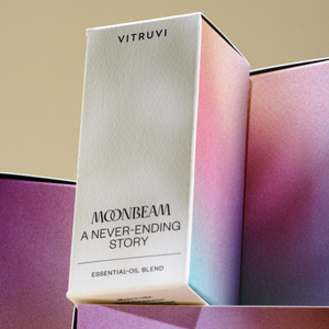 Vitruvi Moonbeam essential oil blend packaging on a gradient background