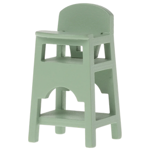 A small, toy high chair for mice in a mint green color, made of wood.
