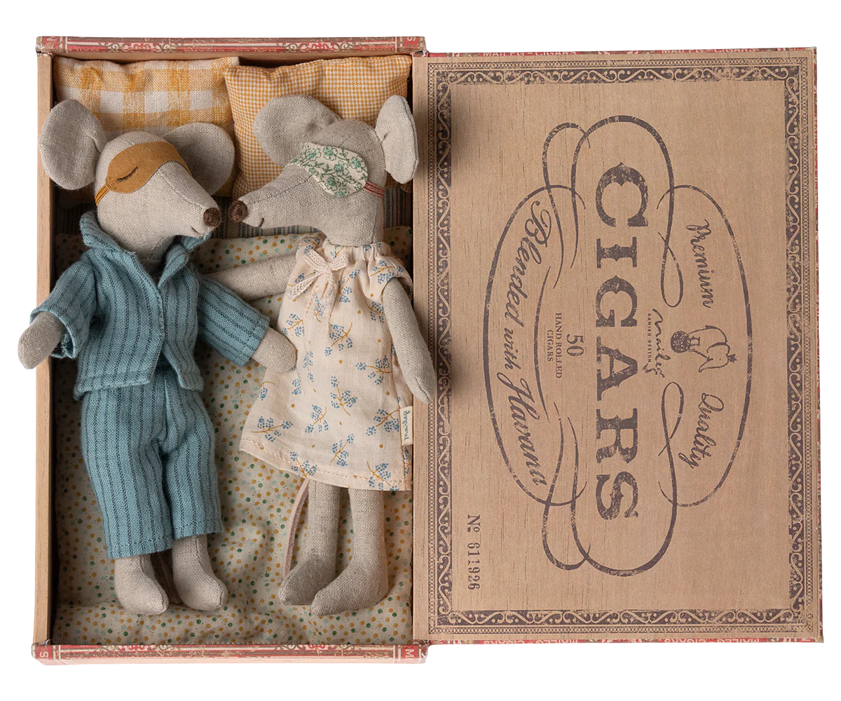 A set of two plush mice, 'Mum' and 'Dad', in nightwear, with a man in a blue shirt and woman in a floral dress, inside an open cigar box with a 'CIGARS' print on the lid.