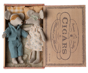A set of two plush mice, 'Mum' and 'Dad', in nightwear, with a man in a blue shirt and woman in a floral dress, inside an open cigar box with a 'CIGARS' print on the lid.