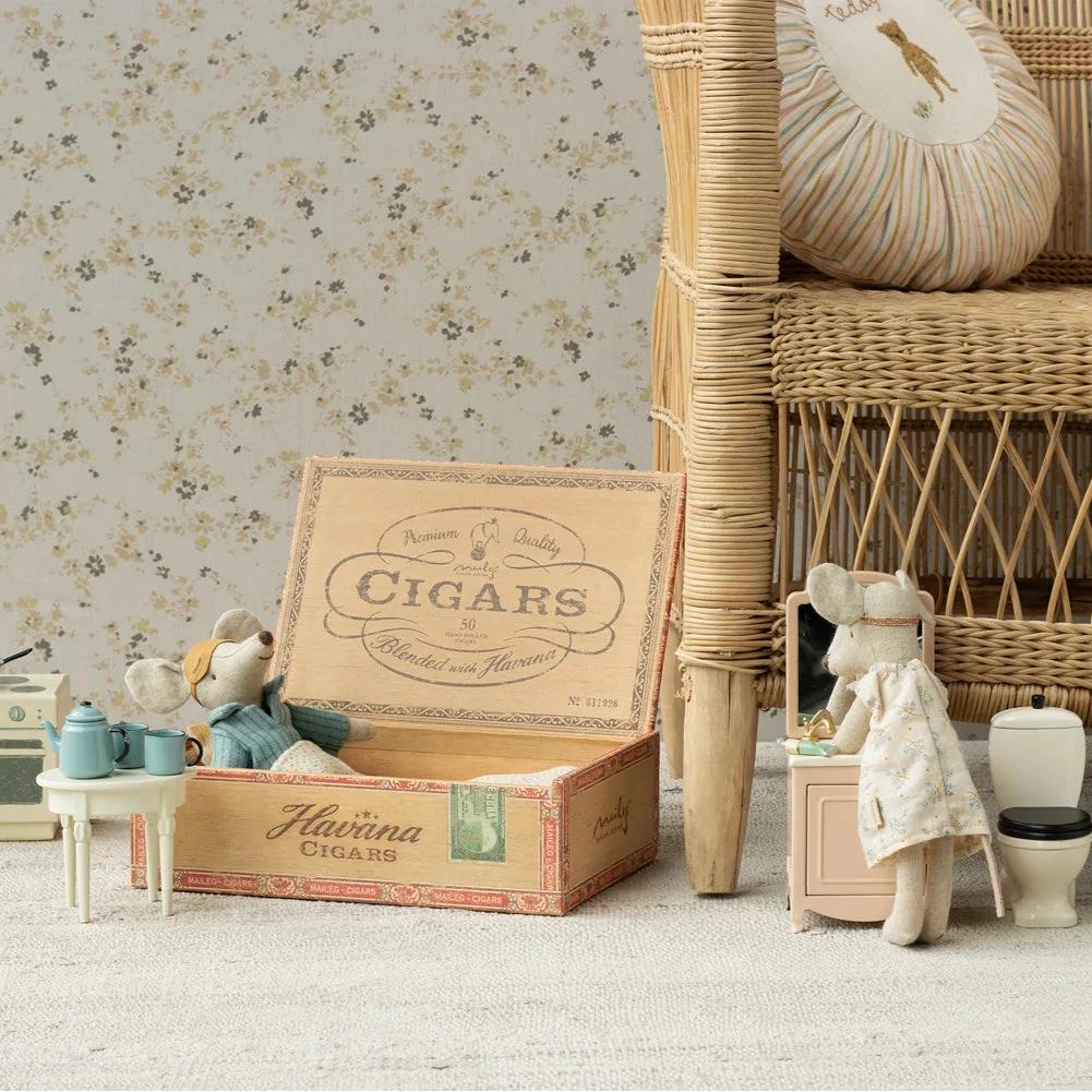 A set of two plush mice, 'Mum' and 'Dad', in nightwear, with a man in a blue shirt and woman in a floral dress, inside an open cigar box with a 'CIGARS' print on the lid.