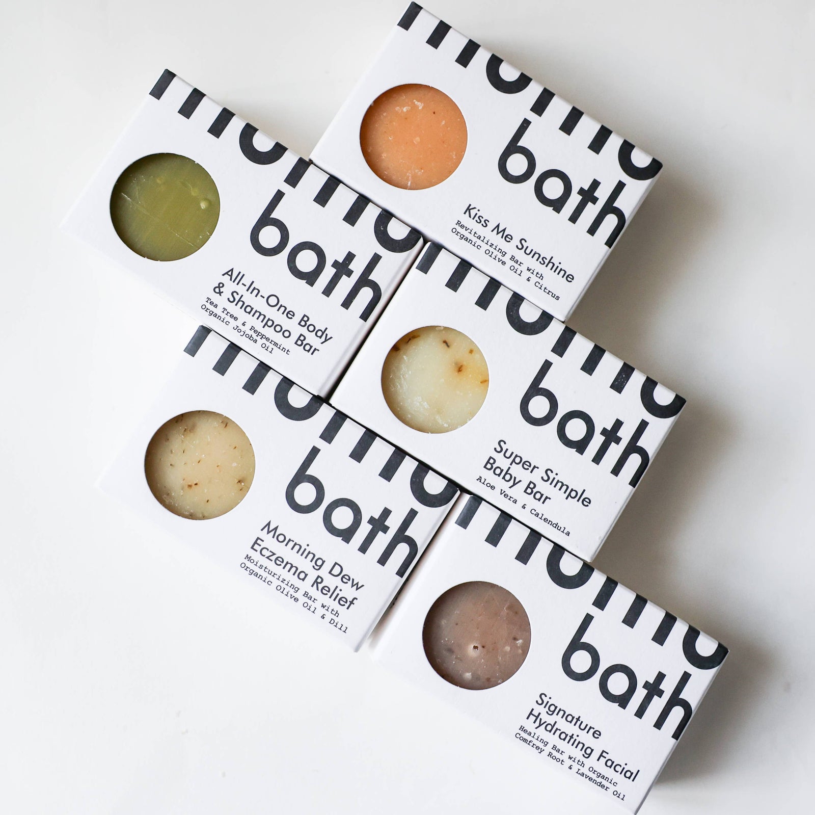 A bar of mumu bath hydrating facial soap on a white background. 