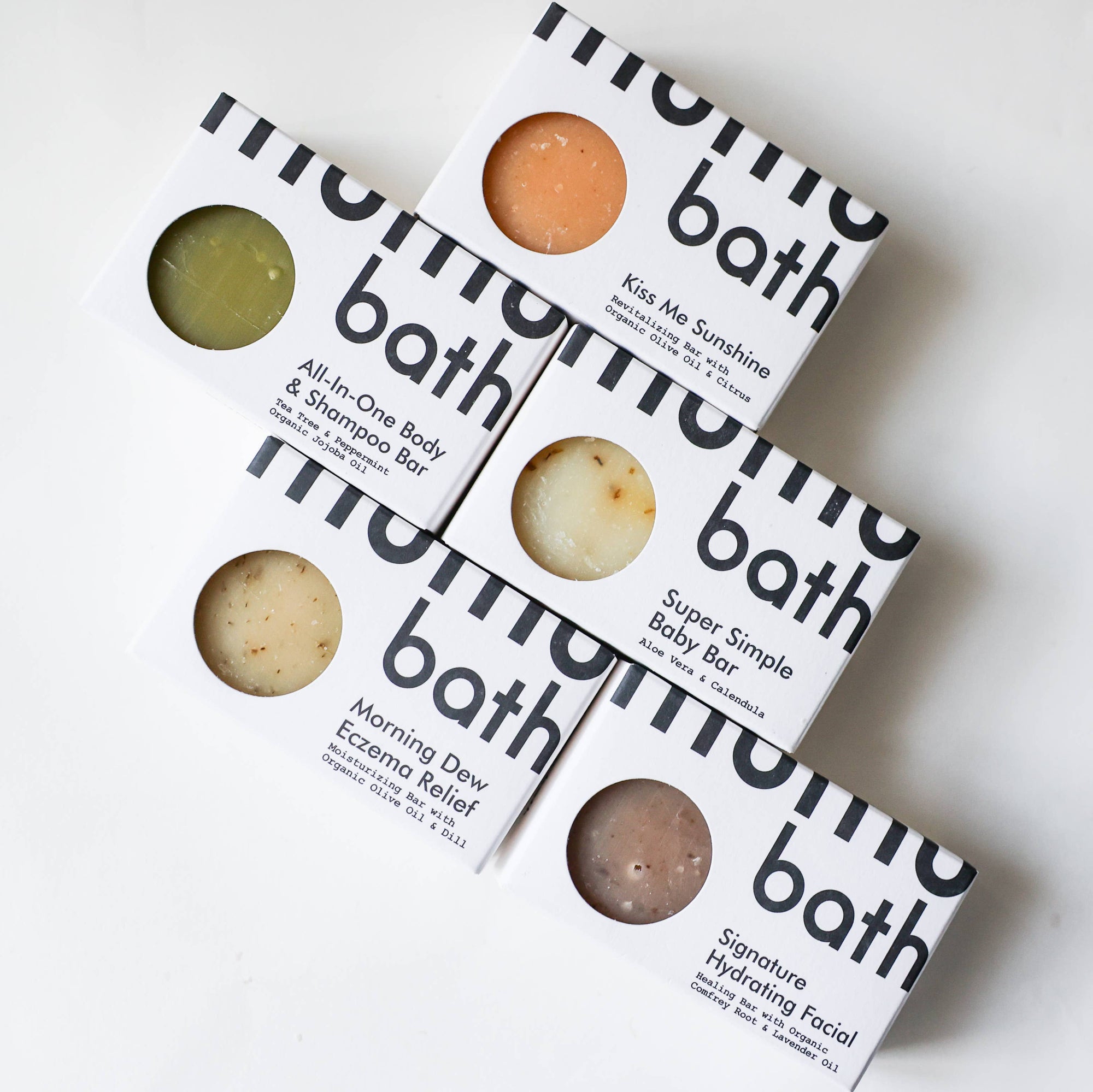 A bar of mumu bath hydrating facial soap on a white background. 