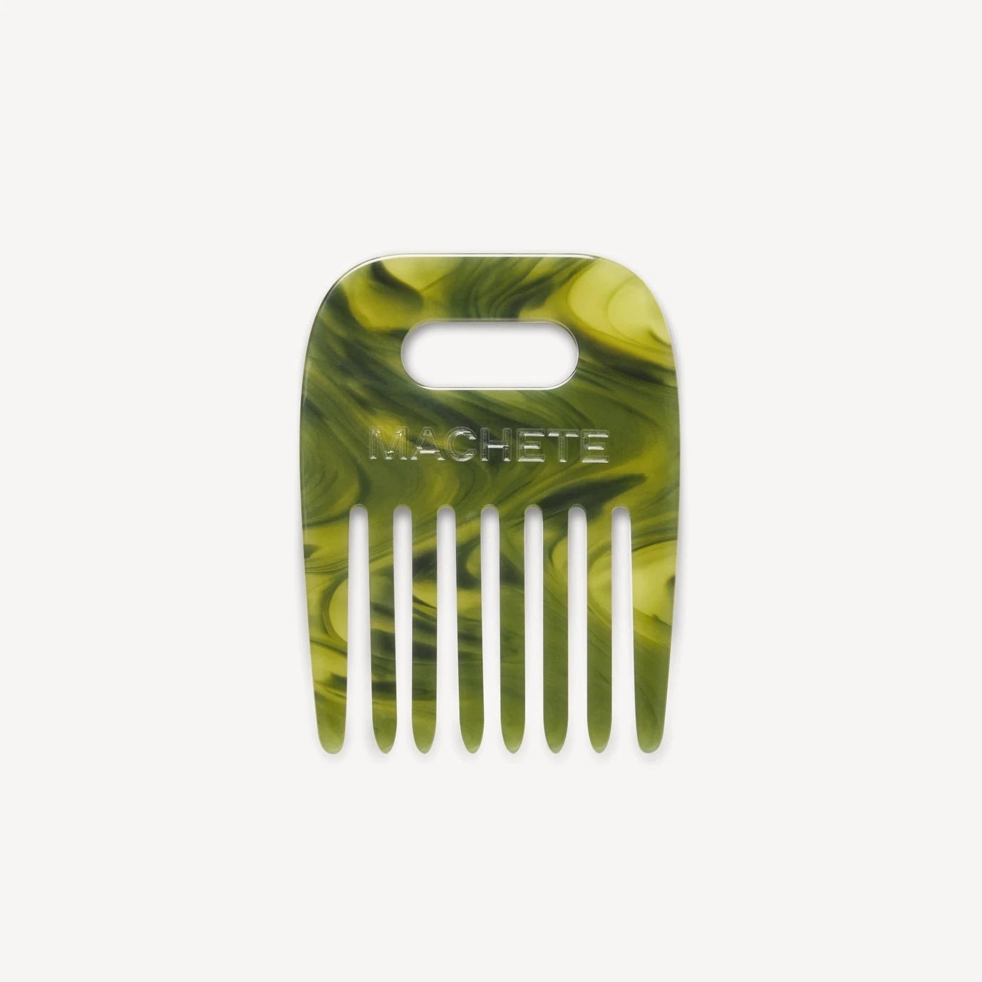 Green marbled hair comb on a white background