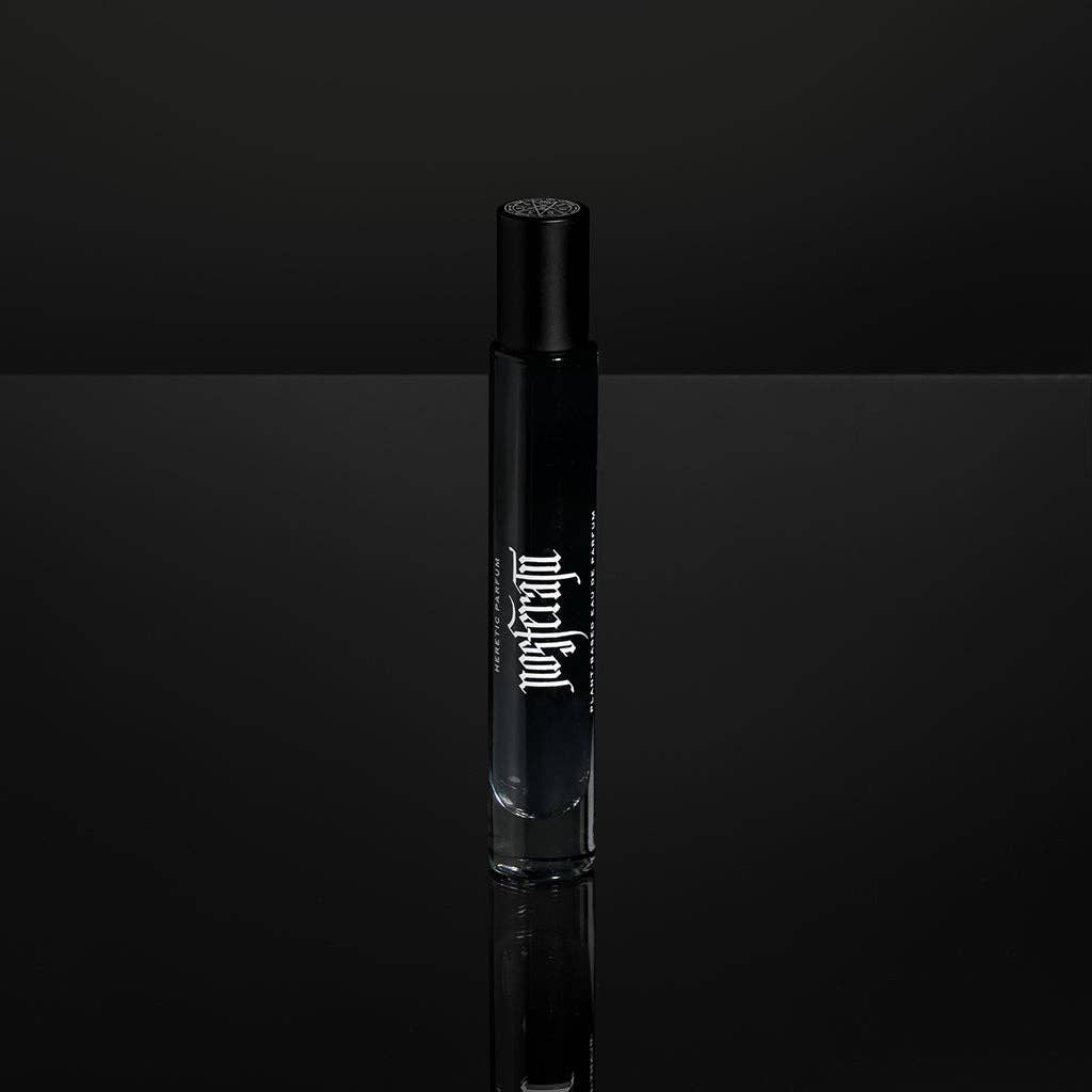 Black perfume decanter with white text on a black background