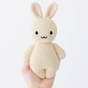 A person holding the Cuddle and Kind oatmeal bunny