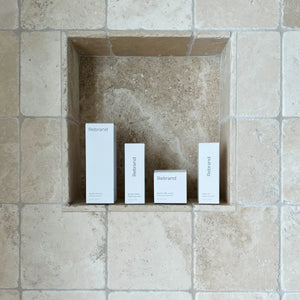 Four white boxes labeled 'Rebrand' in a recessed stone wall.