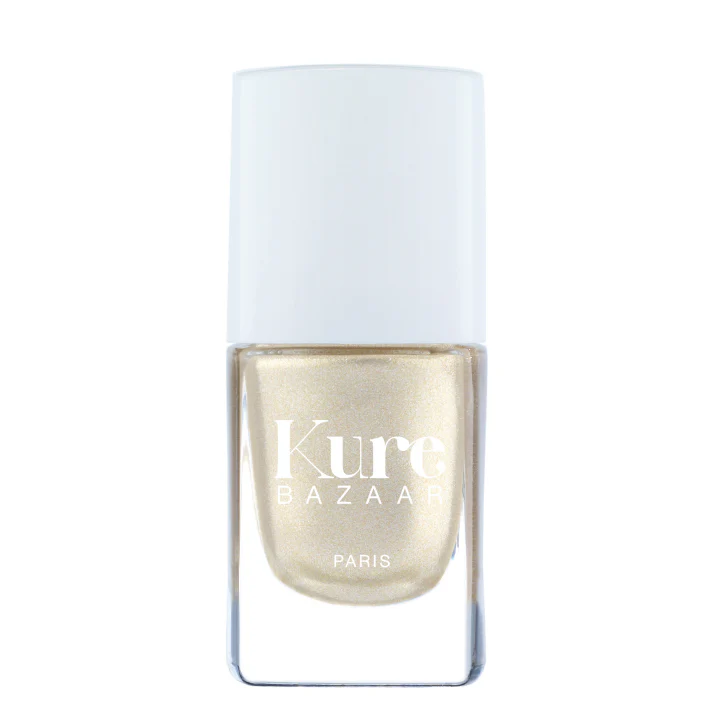 A bottle of Kure Bazaar nail polish in a silver shade with a metallic finish, displayed against a white background.