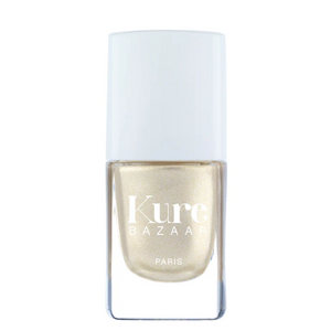 A bottle of Kure Bazaar nail polish in a silver shade with a metallic finish, displayed against a white background.