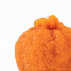 Happy Organics orange candle, hand made and organic.