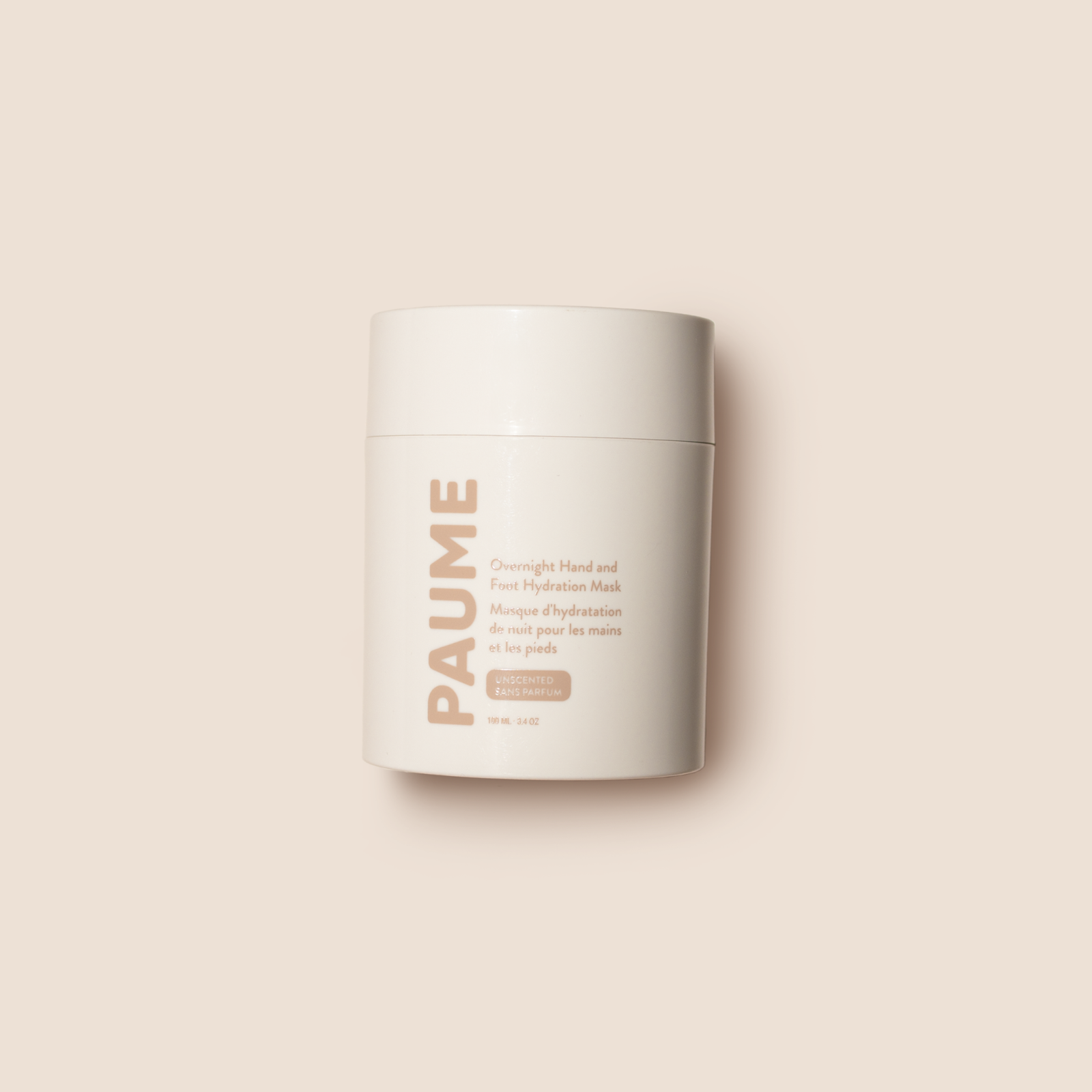 A white cylindrical container with a minimalistic design, labeled 'PAUME', containing the Overnight Hand and Foot Hydration Mask.