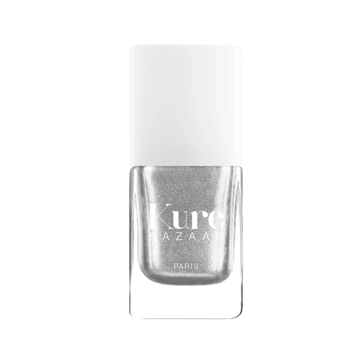 A bottle of Kure Bazaar nail polish in a silver shade with a metallic finish, displayed against a white background.